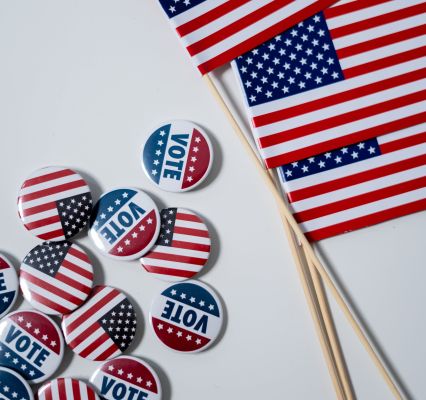 American Flags and Pins on White Background